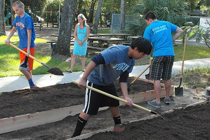students working in garden
